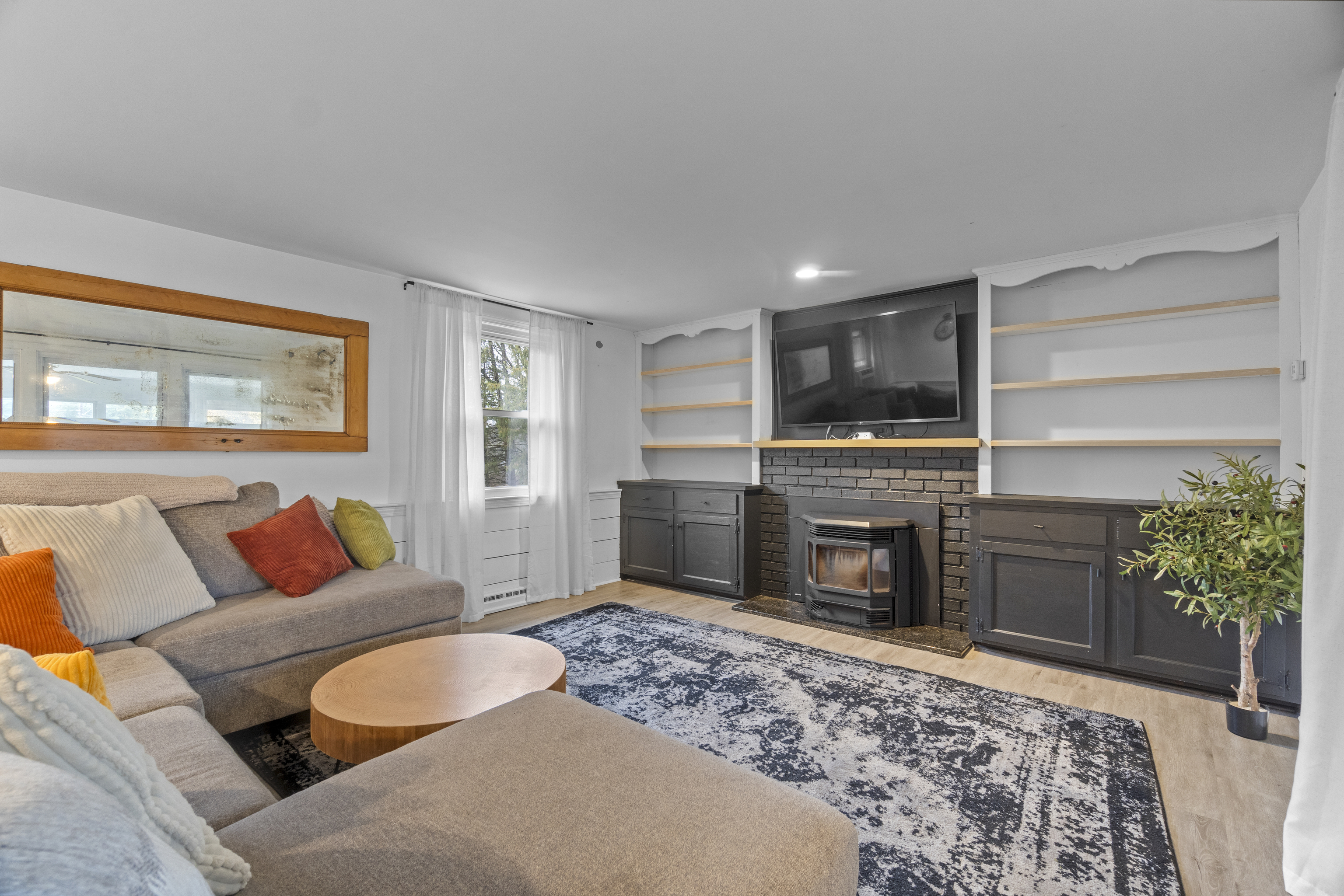 10 Green Acres Lane Thompson, CT 06255 - Photo 25 of 40 a living room with furniture and a fireplace