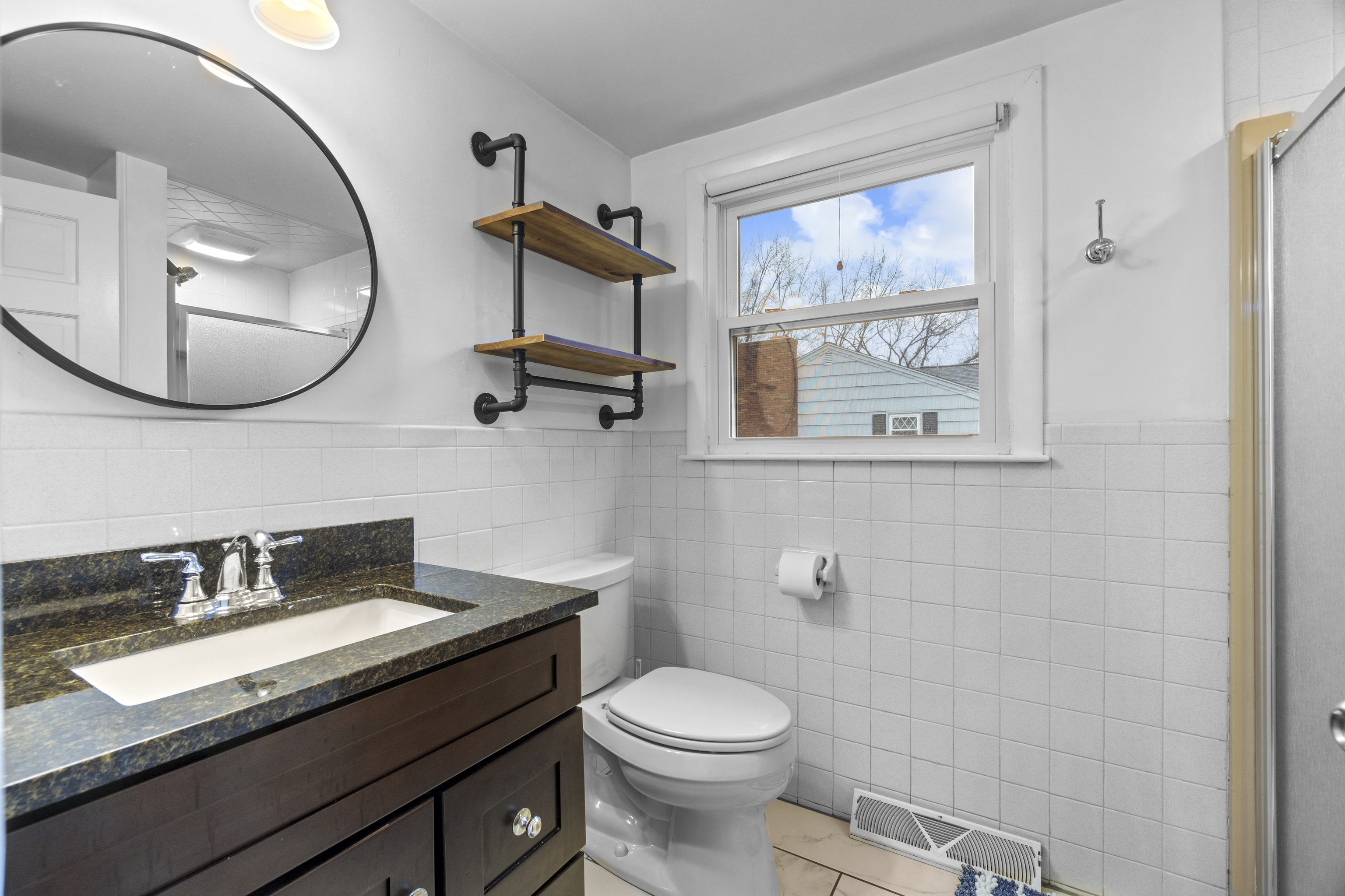 10 Green Acres Lane Thompson, CT 06255 - Photo 28 of 40 a bathroom with a toilet a sink and mirror