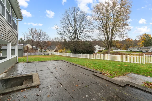 a view of outdoor space with garden and trees