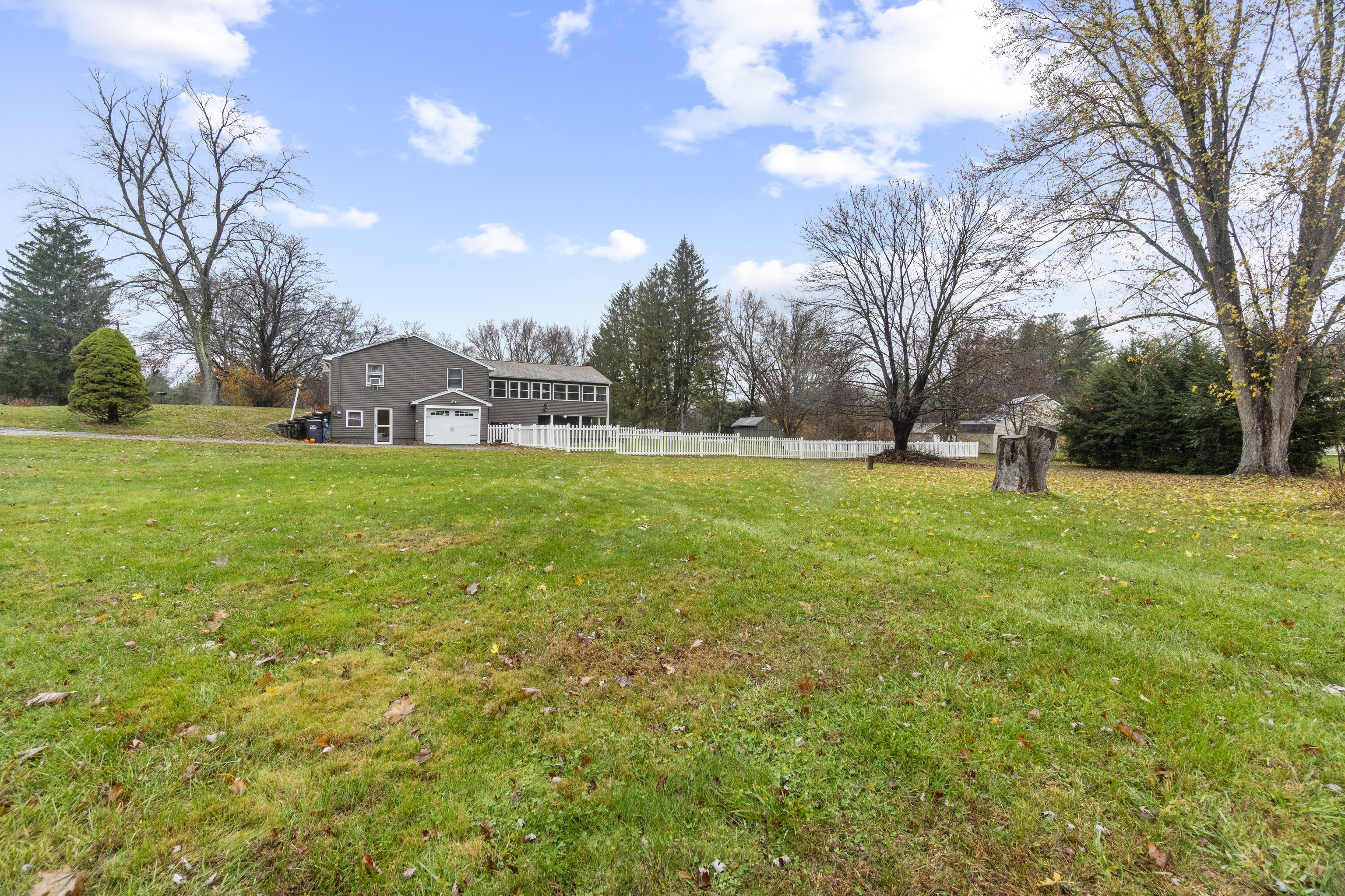 10 Green Acres Lane Thompson, CT 06255 - Photo 38 of 40 a view of a big yard with a house in the background