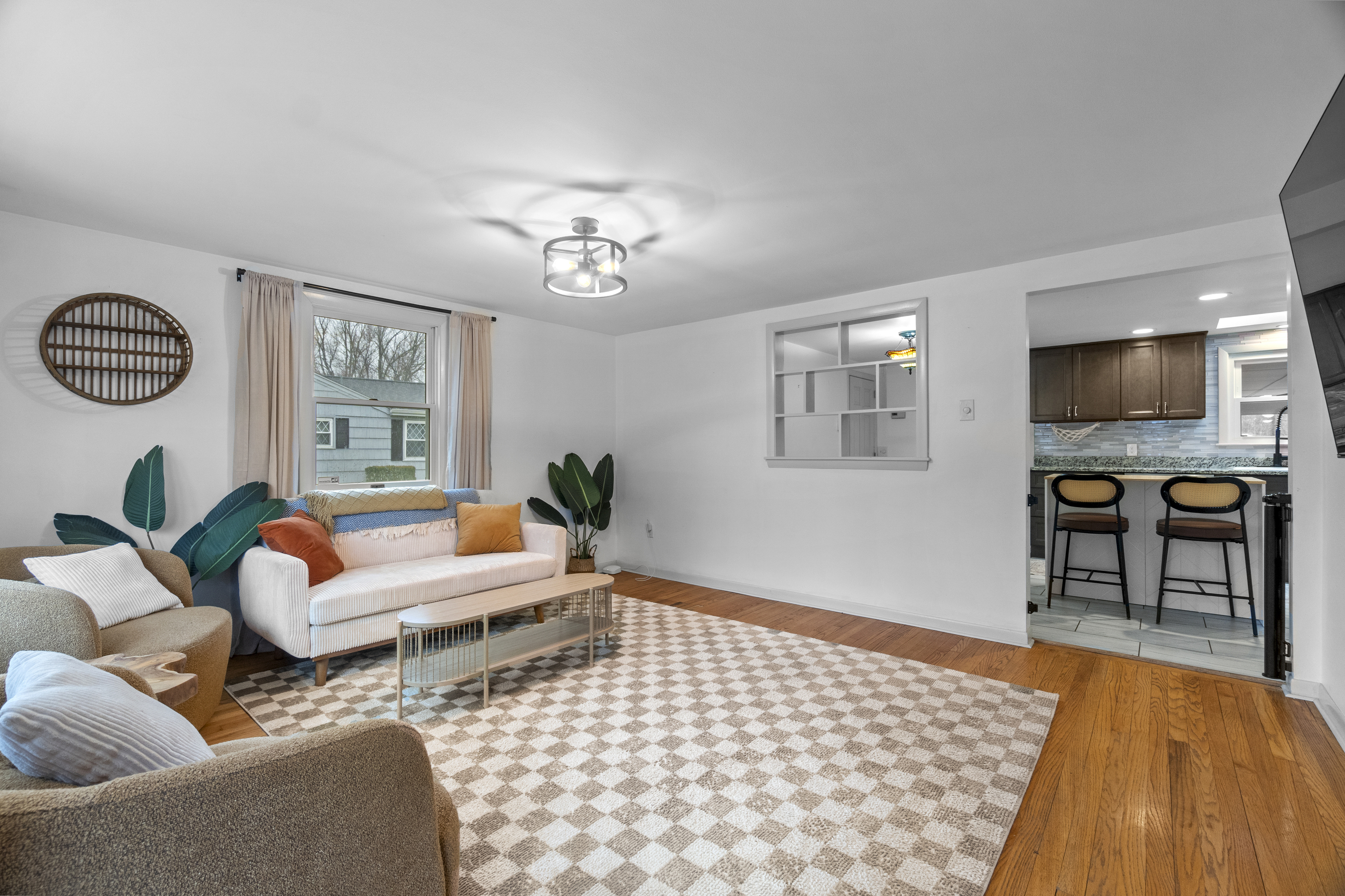 10 Green Acres Lane Thompson, CT 06255 - Photo 7 of 40 a living room with furniture a flat screen tv and a window