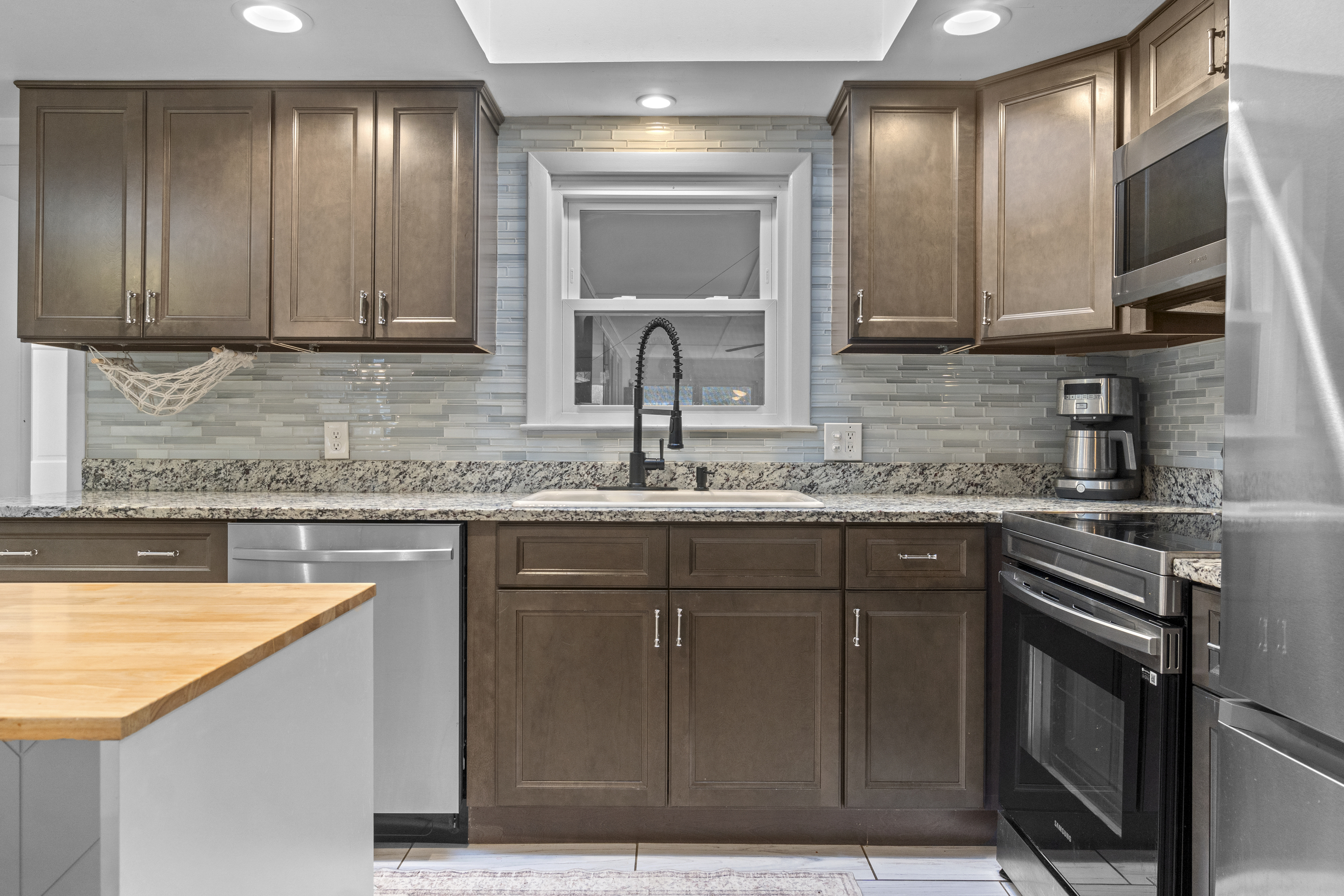 10 Green Acres Lane Thompson, CT 06255 - Photo 8 of 40 a kitchen with stainless steel appliances granite countertop wooden cabinets a sink and dishwasher