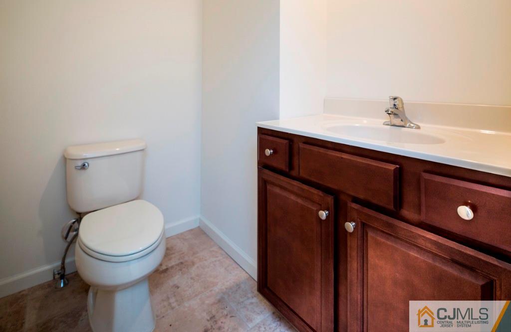 388 Aldrich Road Howell, NJ 07731 - Photo 13 of 24 a bathroom with a toilet and a sink