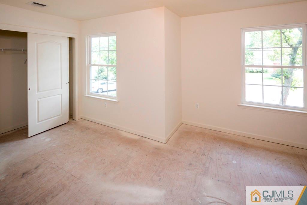388 Aldrich Road Howell, NJ 07731 - Photo 15 of 24 an empty room with windows