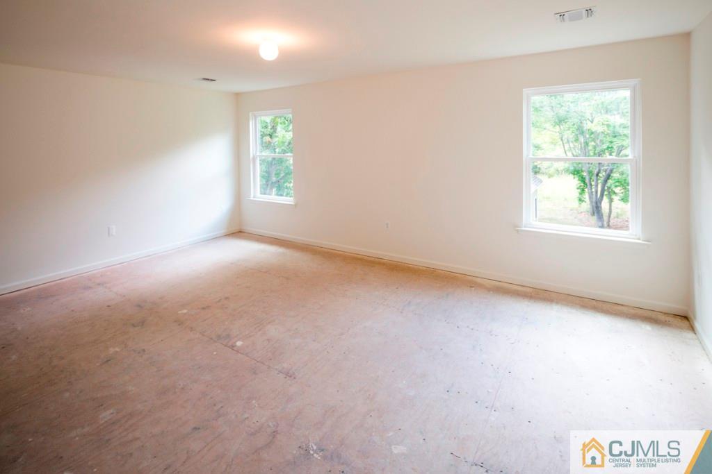 388 Aldrich Road Howell, NJ 07731 - Photo 19 of 24 an empty room with windows and closet