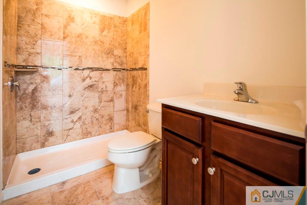 388 Aldrich Road Howell, NJ 07731 - Photo 21 of 24 a bathroom with a sink and a toilet