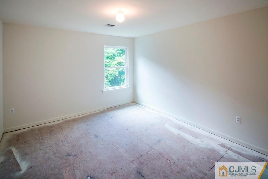 388 Aldrich Road Howell, NJ 07731 - Photo 22 of 24 an empty room with windows