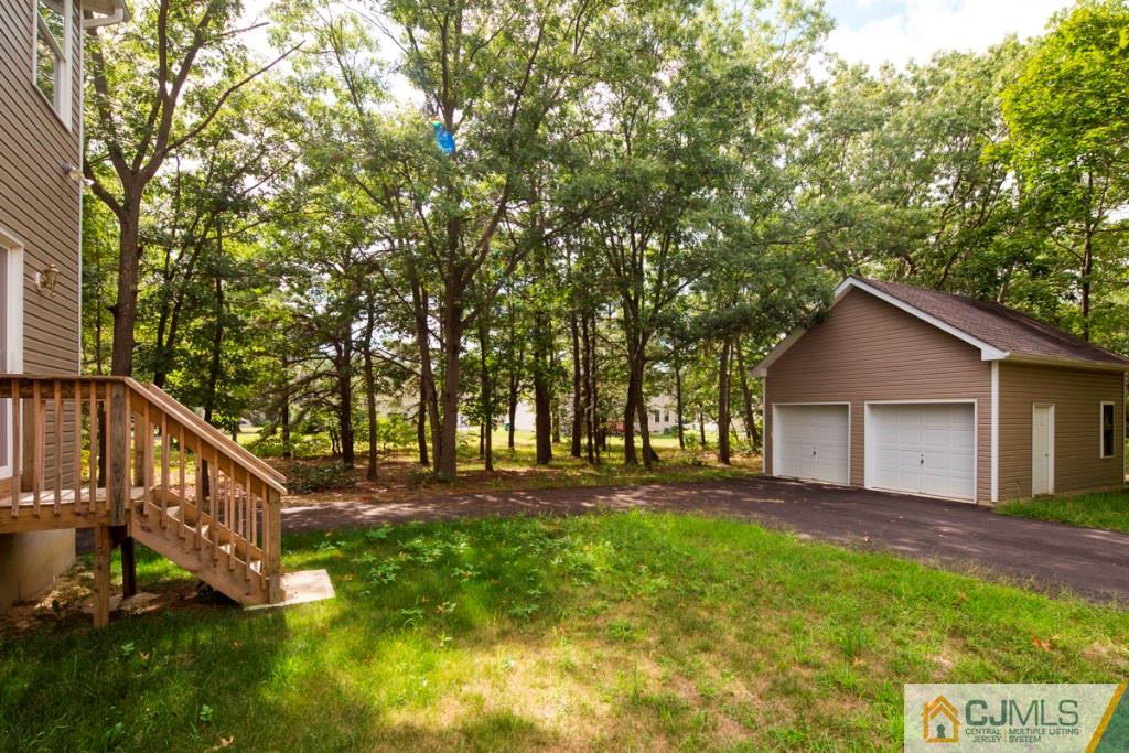 388 Aldrich Road Howell, NJ 07731 - Photo 23 of 24 front view of house with a yard