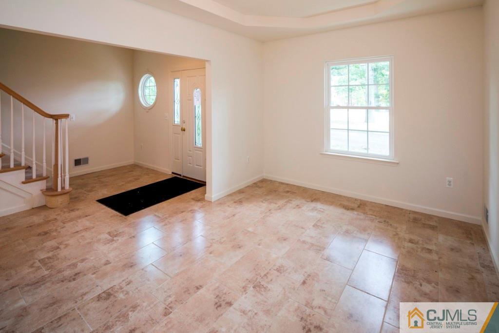 388 Aldrich Road Howell, NJ 07731 - Photo 4 of 24 a view of empty room with wooden floor