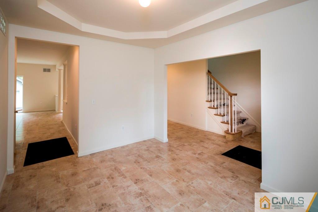 388 Aldrich Road Howell, NJ 07731 - Photo 5 of 24 a view of entryway and hall with a wooden floor