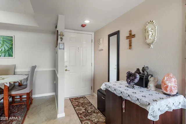 a bedroom with a bed and a dresser in it