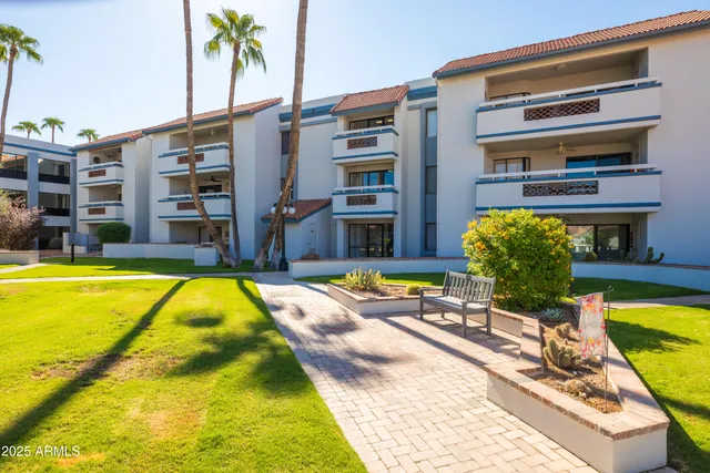 a view of swimming pool with chairs