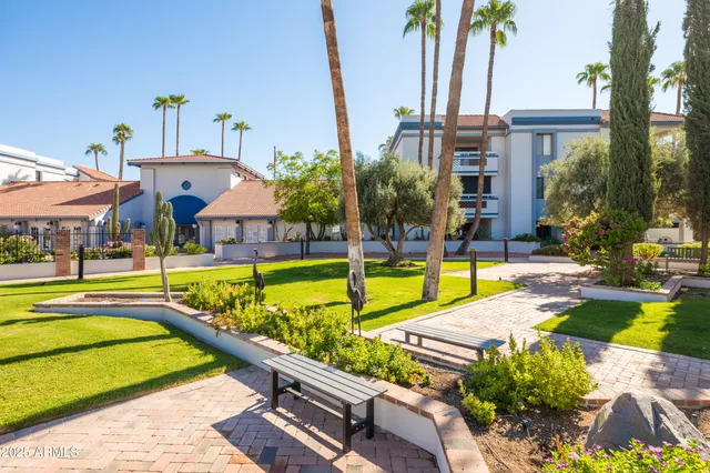 a view of multiple houses with a yard