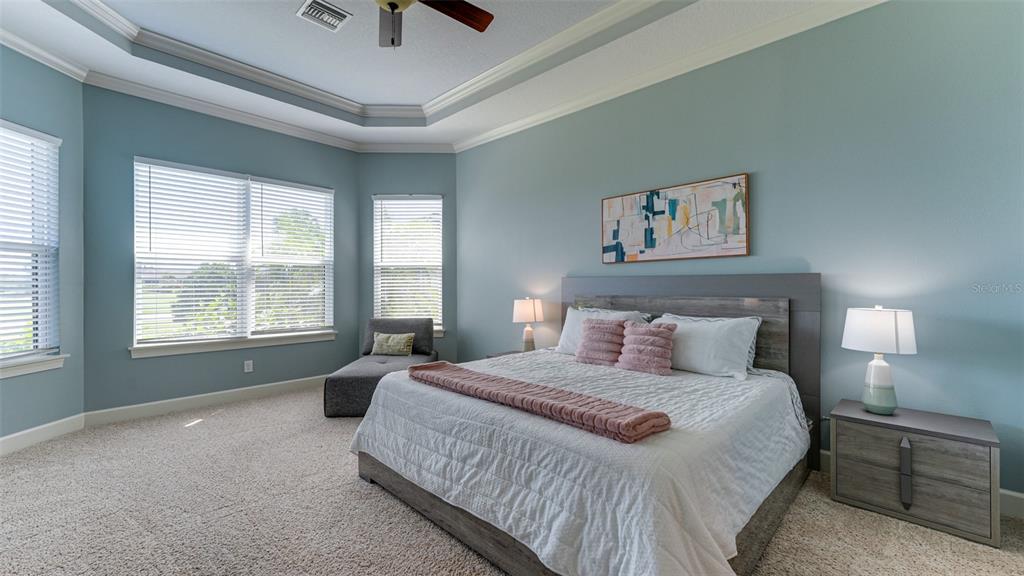 4511 Terrazza Court Lakewood Ranch, FL 34211 - Photo 15 of 65 a bedroom with a bed and a large window
