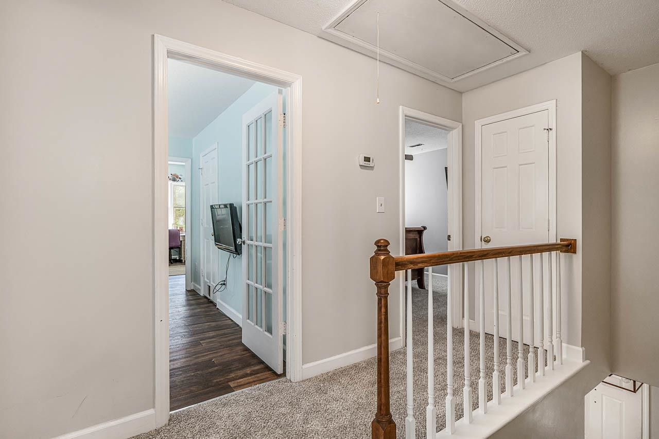 921 Fairlong Road Wake Forest, NC 27587 - Photo 21 of 46 Upstairs Hallway with Linen Closet