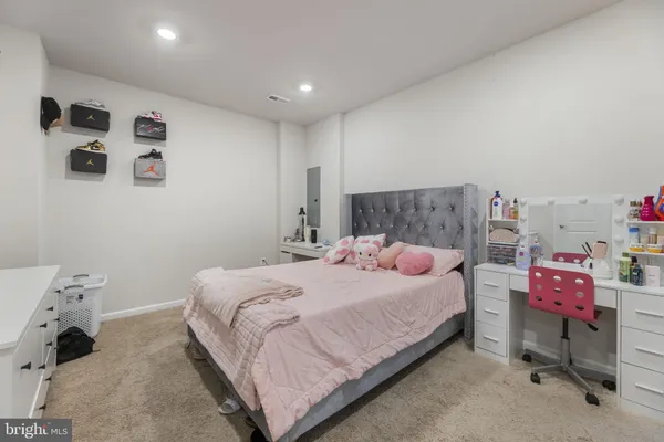 a bedroom with a bed and a table in it
