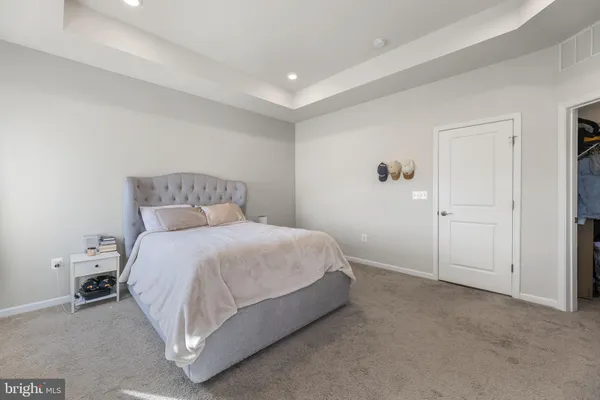 a bedroom with a bed and closet