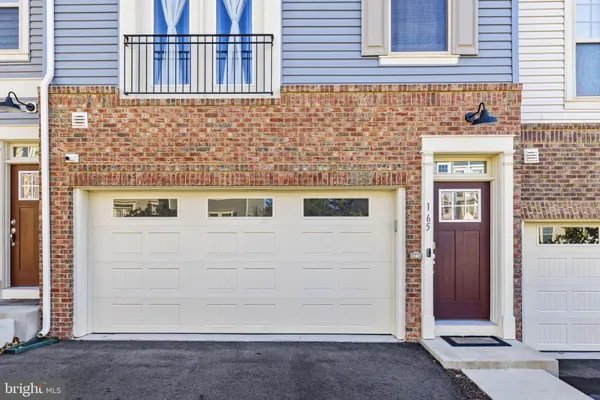 a front view of a house with parking space