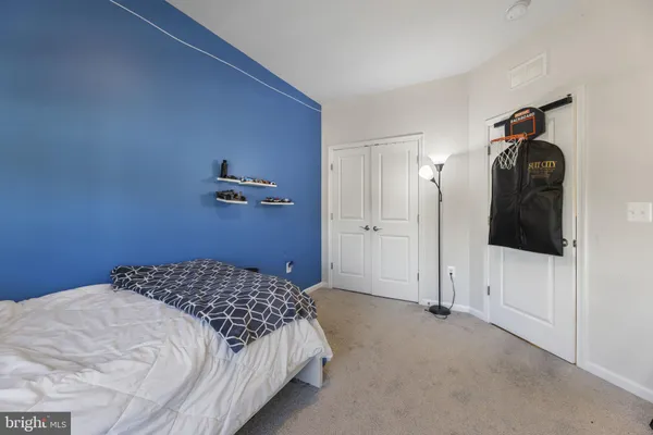 a bedroom with a bed and a view of bathroom