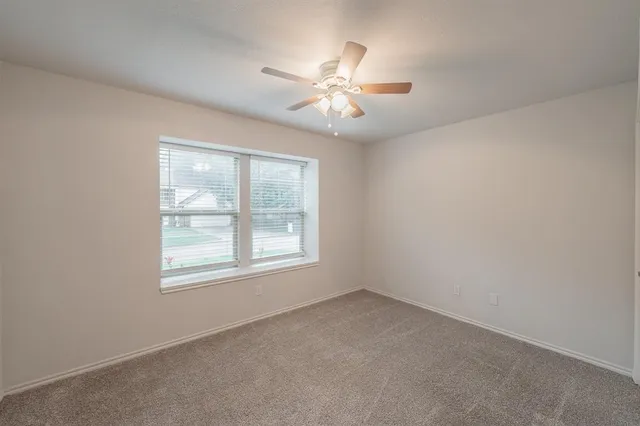 a bathroom with a granite countertop toilet a sink and bathtub