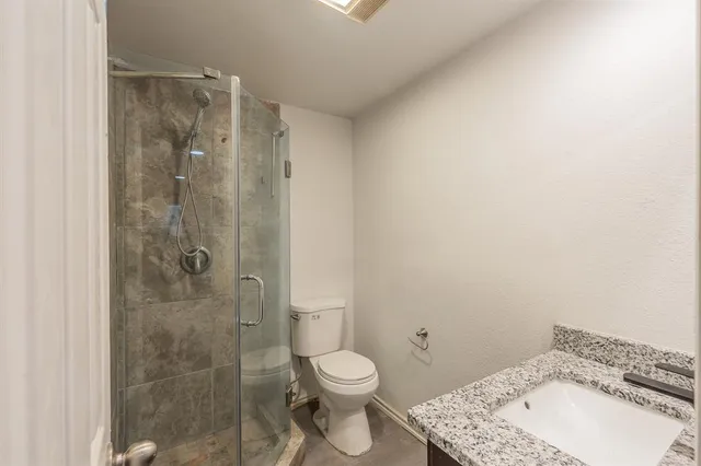 a room with a sink and cabinets