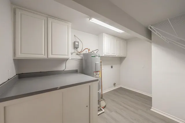 a view of an empty room with a ceiling fan
