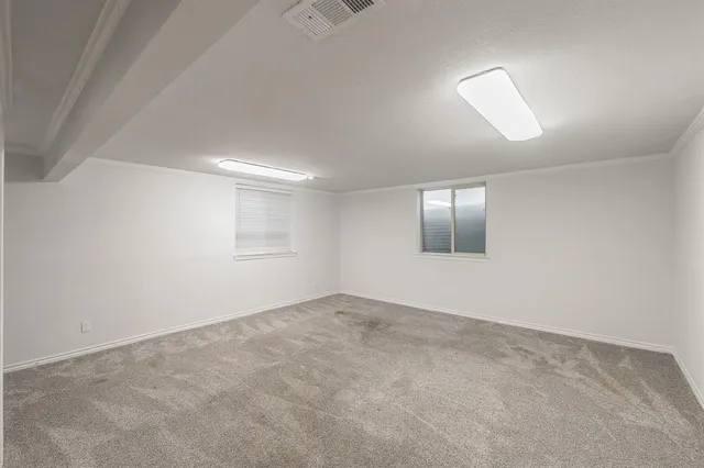 en empty room with closet and a bathroom