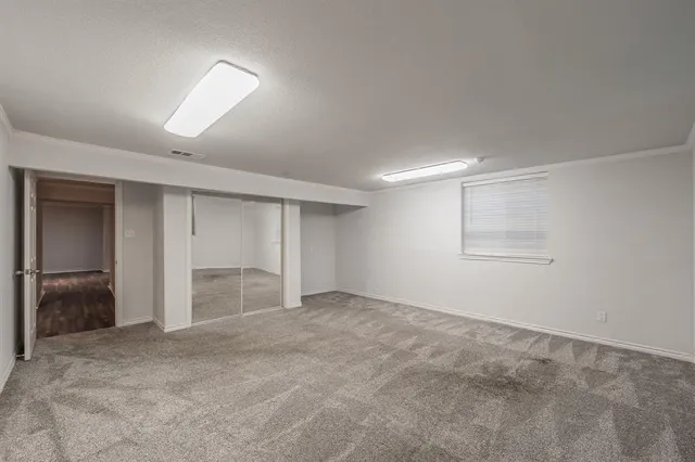a view of a big room with a chandelier fan