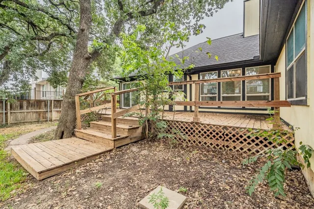 a balcony with furniture and a potted plant