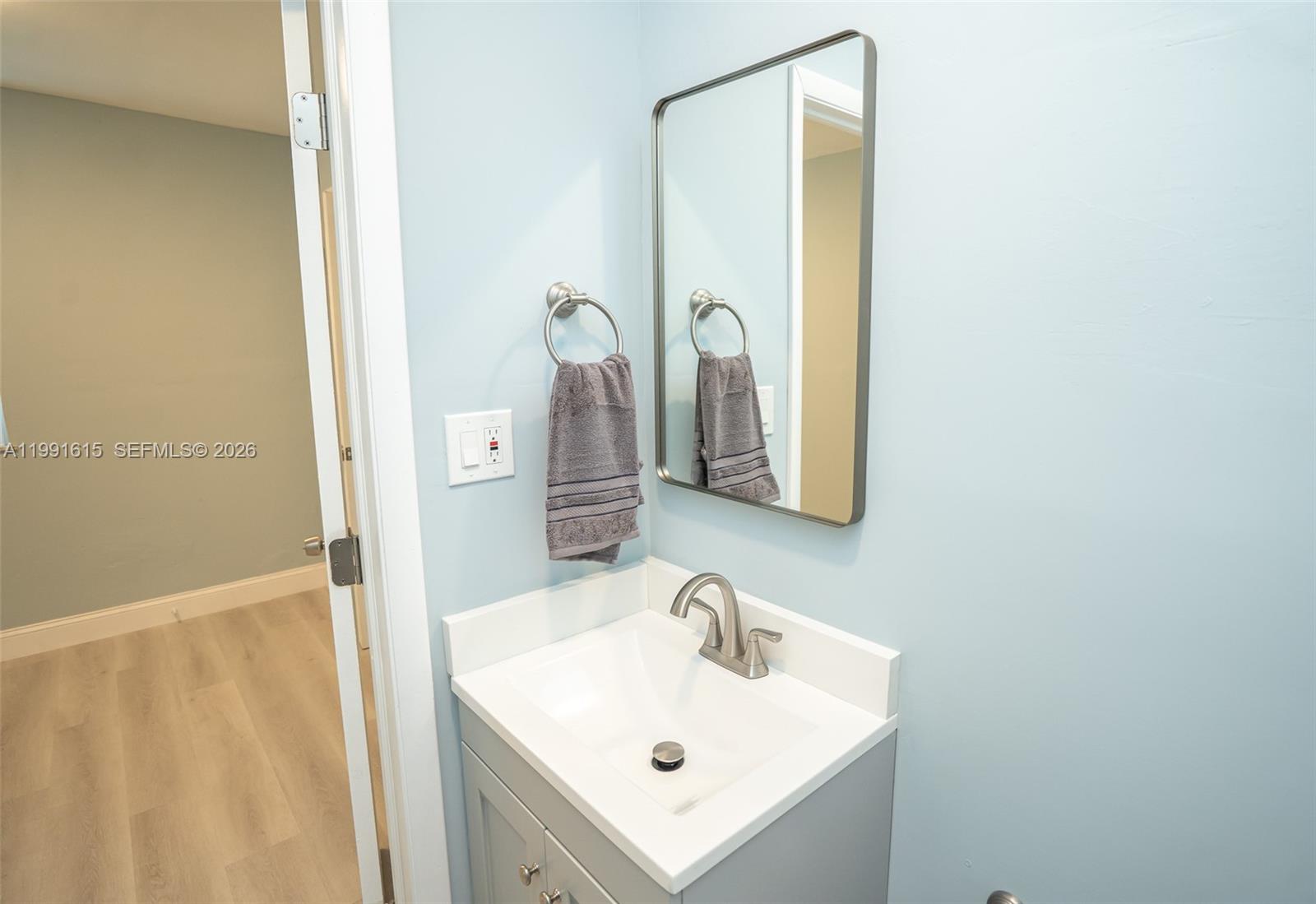 2230 Southwest 60th Court Miami, FL 33155 - Photo 27 of 35 a bathroom with a sink a mirror and shower