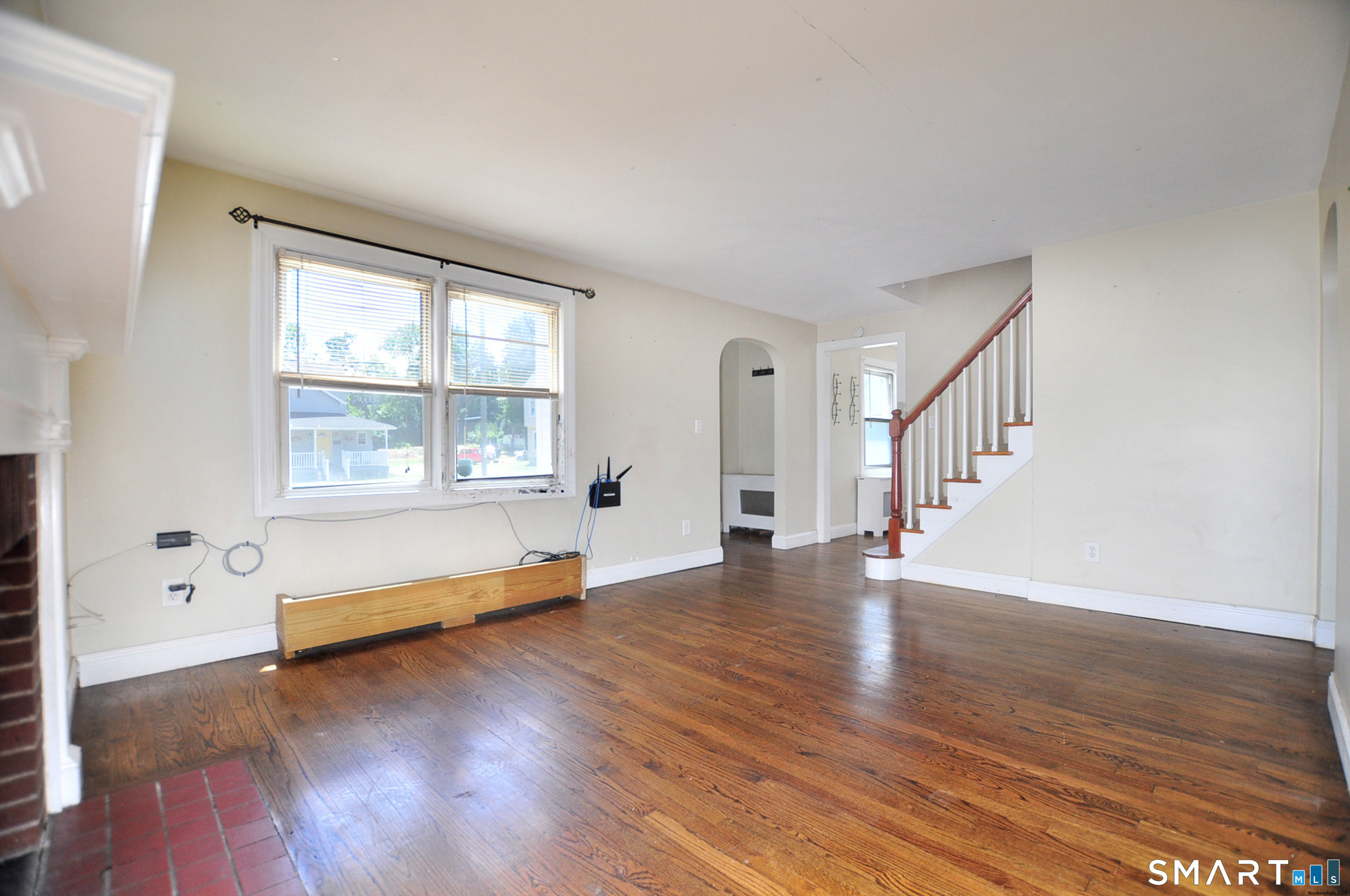 103 West Center Street Manchester, CT 06040 - Photo 10 of 29 a view of an empty room with wooden floor and a window