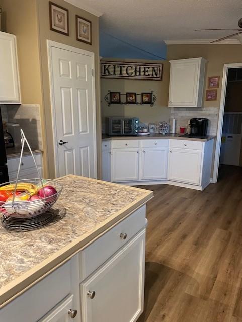 445 County Road 1227 Quitman, TX 75783 - Photo 11 of 29 a kitchen with kitchen island a sink a stove and cabinets