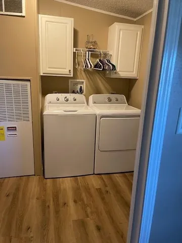 a view of storage and utility room with a refrigerator
