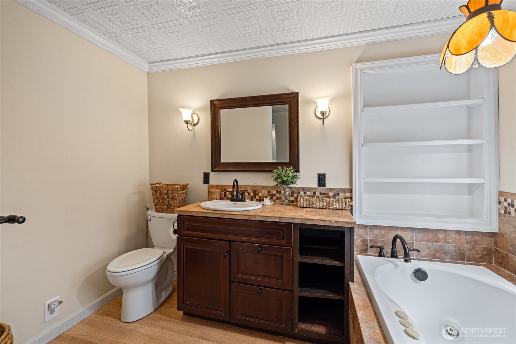 21260 Lake 16 Road Mount Vernon, WA 98274 - Photo 17 of 40 a bathroom with a granite countertop sink toilet and a bathtub
