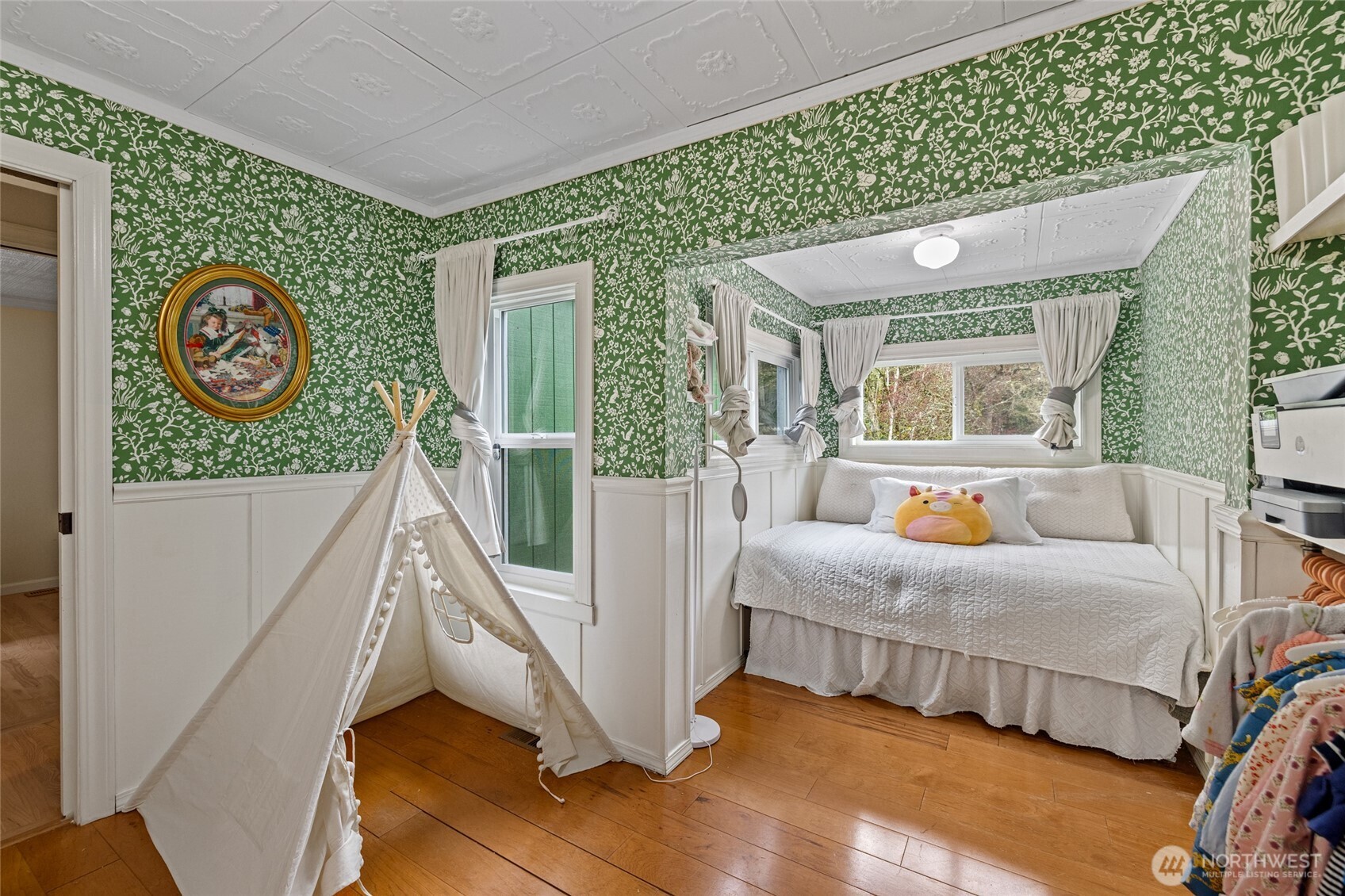 21260 Lake 16 Road Mount Vernon, WA 98274 - Photo 18 of 40 a bedroom with a bed a mirror and a window