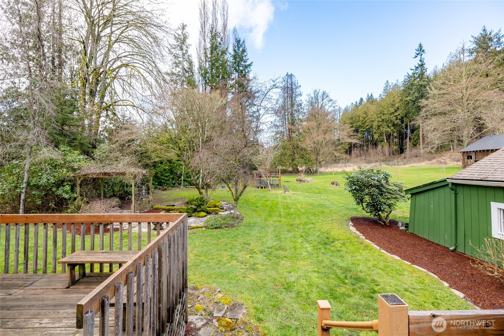 21260 Lake 16 Road Mount Vernon, WA 98274 - Photo 28 of 40 a view of a deck and backyard with green space
