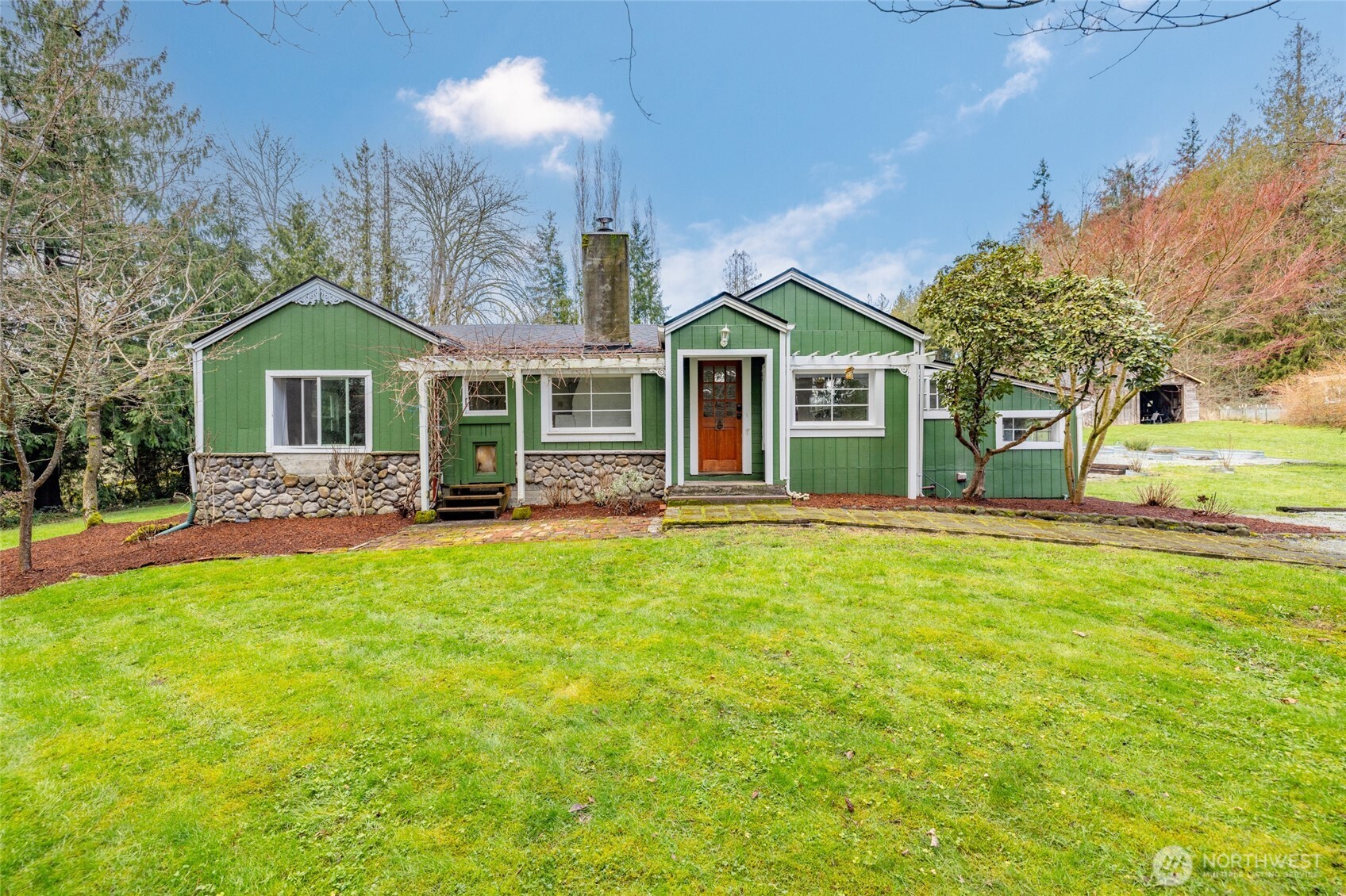 21260 Lake 16 Road Mount Vernon, WA 98274 - Photo 29 of 40 a front view of a house with a yard table and chairs