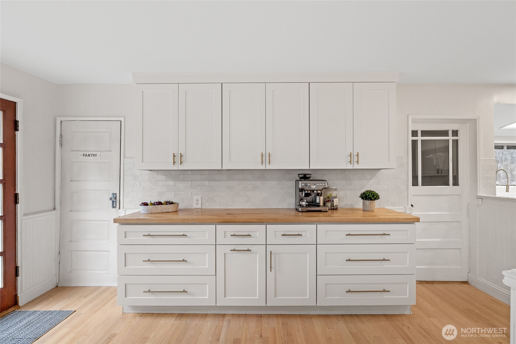 21260 Lake 16 Road Mount Vernon, WA 98274 - Photo 5 of 40 a kitchen with granite countertop white cabinets and sink