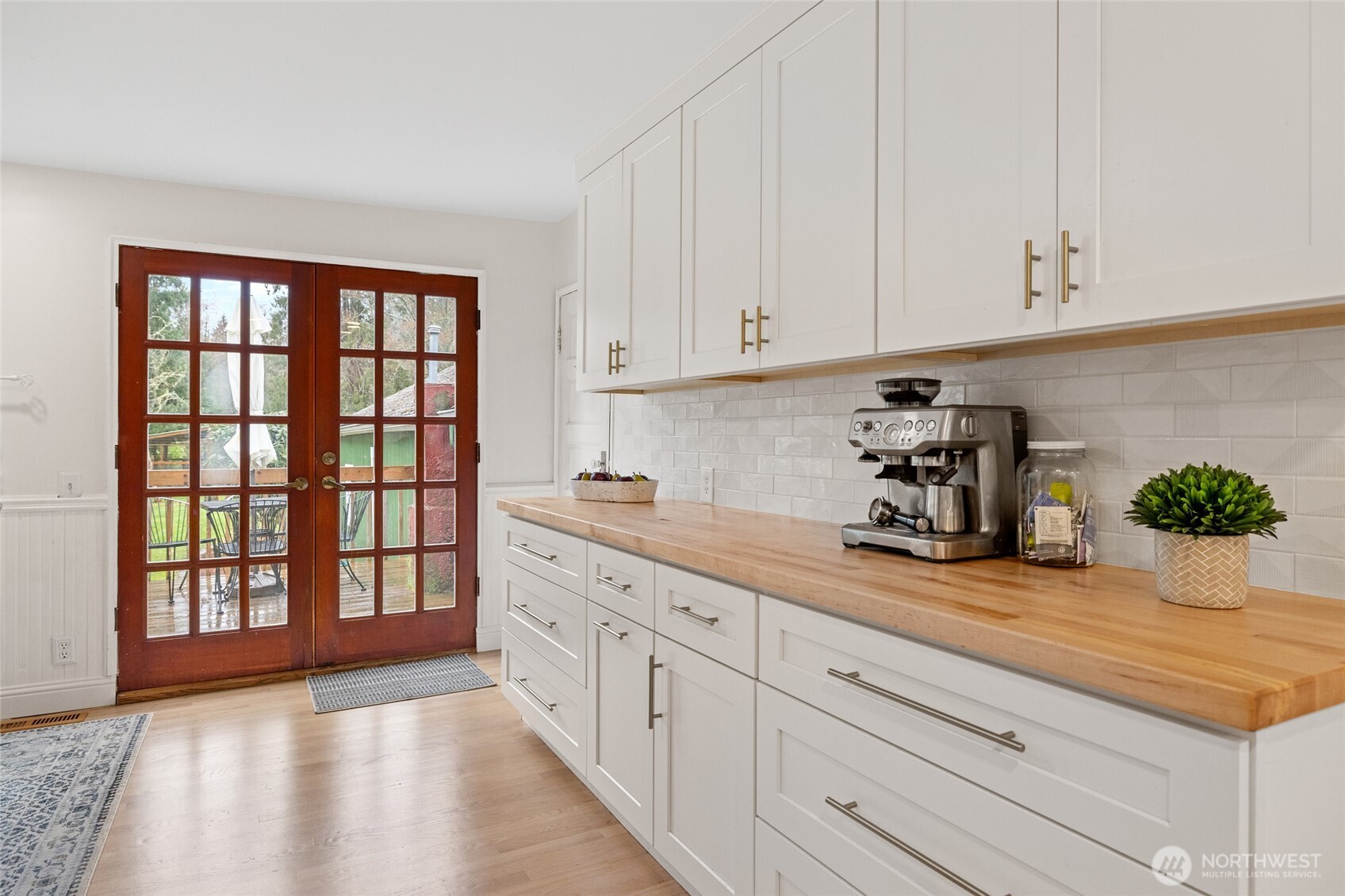 21260 Lake 16 Road Mount Vernon, WA 98274 - Photo 7 of 40 a kitchen with granite countertop white cabinets and a window