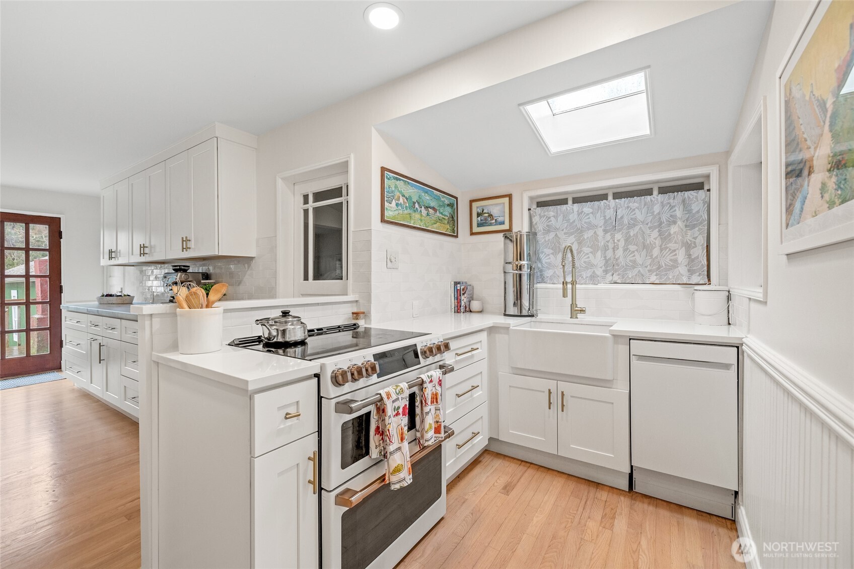 21260 Lake 16 Road Mount Vernon, WA 98274 - Photo 9 of 40 a kitchen with a stove top oven sink and cabinets