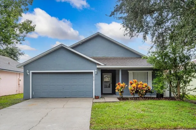 a front view of house with yard and porch