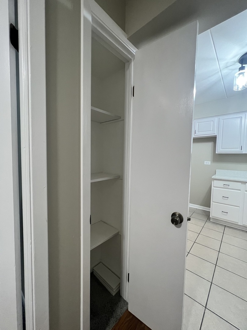 3330 Grove Avenue, Unit 1N Berwyn, IL 60402 - Photo 19 of 20 a bathroom with a glass door shower