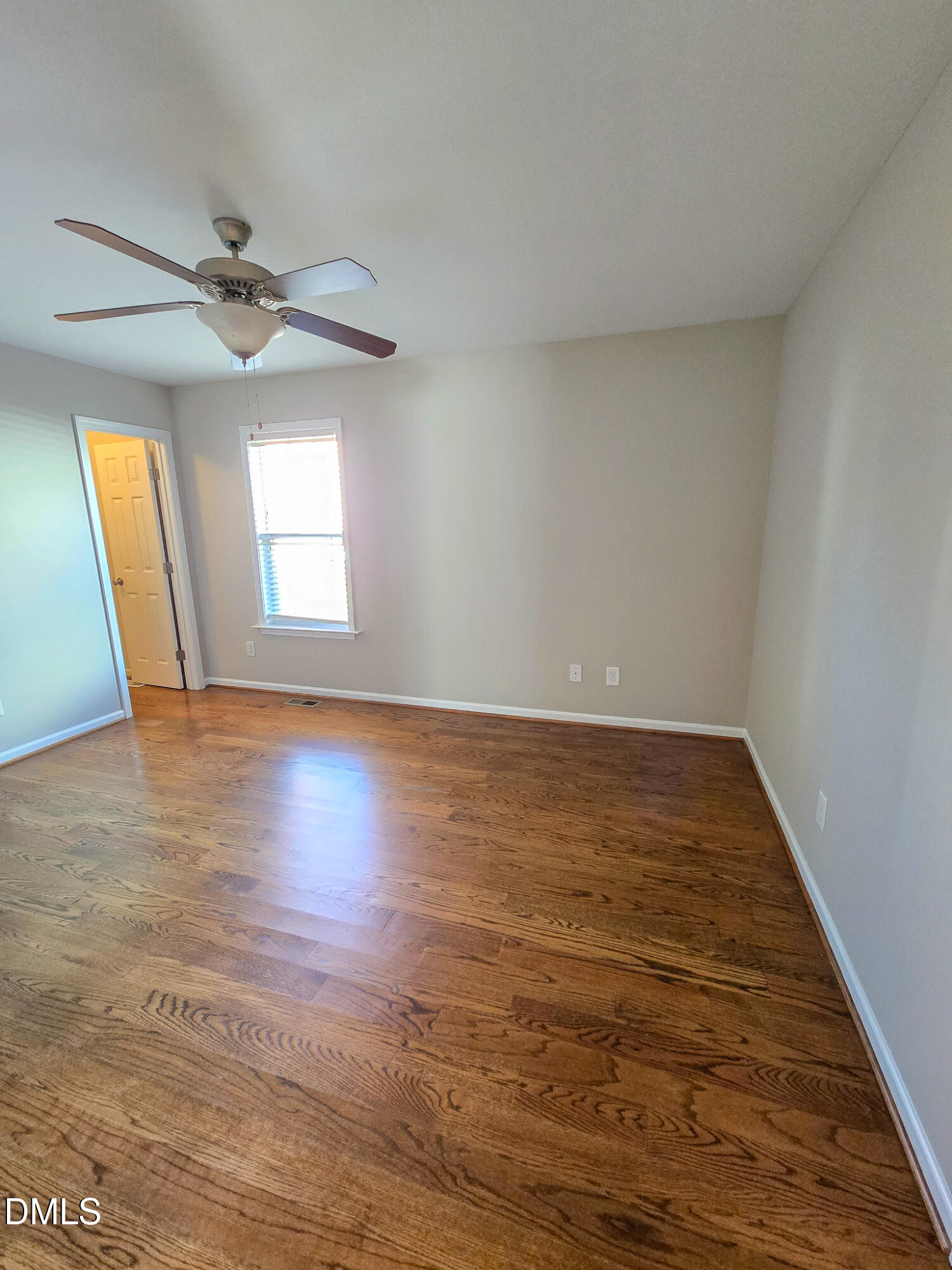 1133 South State Street Raleigh, NC 27601 - Photo 15 of 34 an empty room with wooden floor and windows