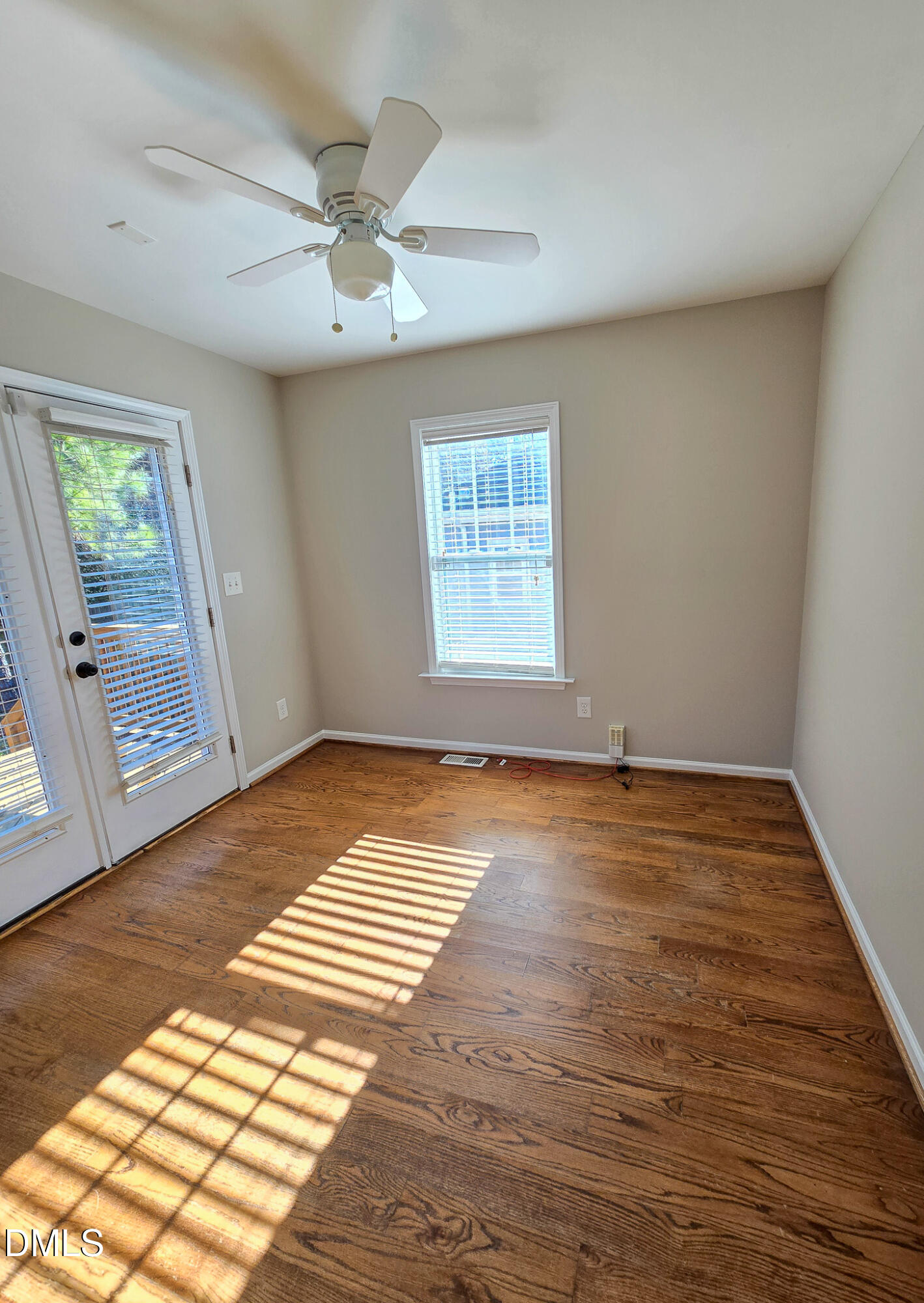 1133 South State Street Raleigh, NC 27601 - Photo 25 of 34 an empty room with wooden floor and windows