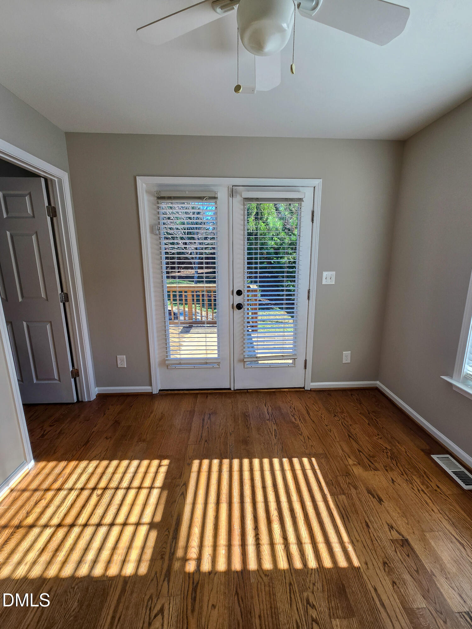 1133 South State Street Raleigh, NC 27601 - Photo 27 of 34 a view of an empty room with wooden floor and a window