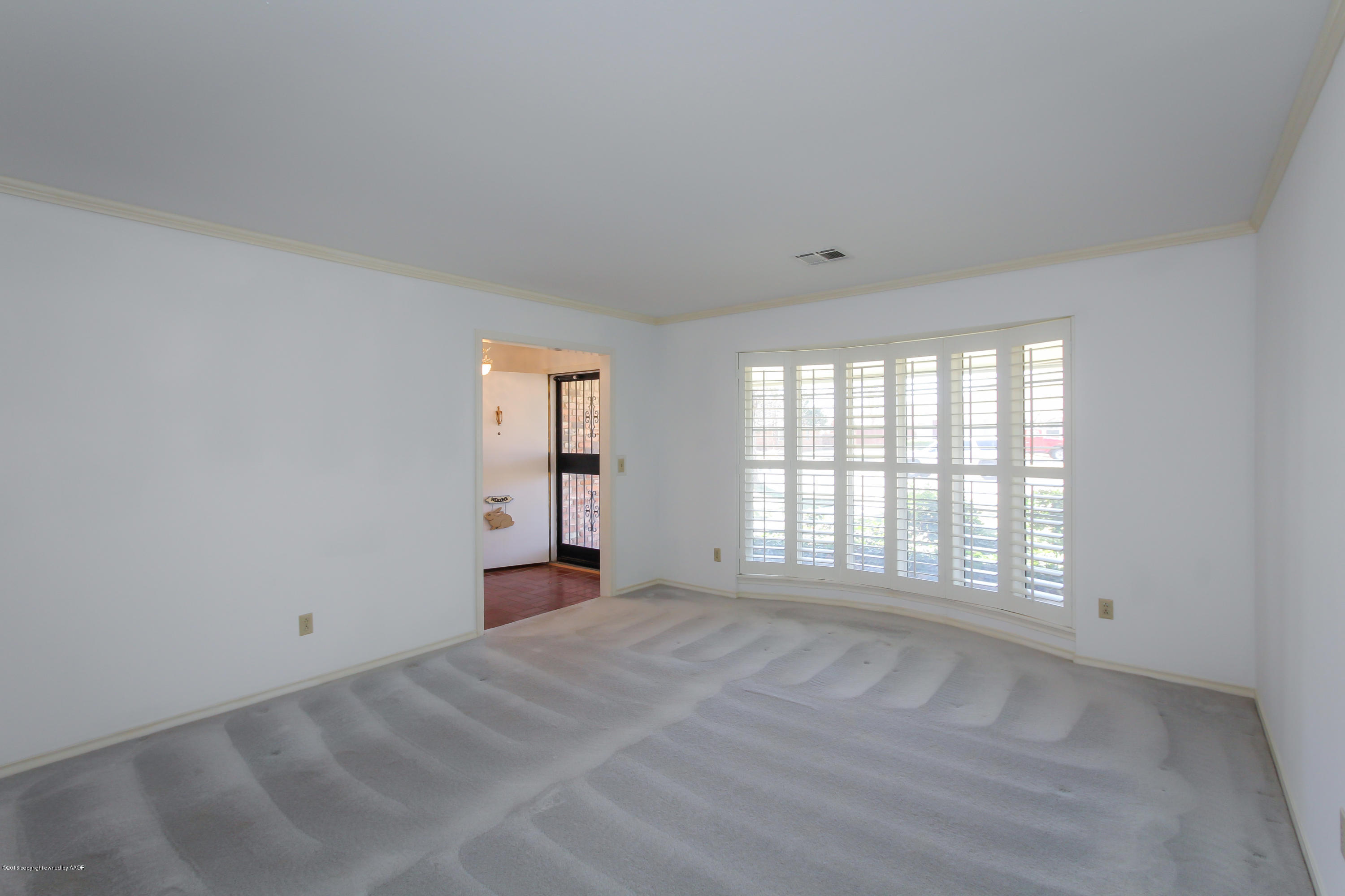 7012 Dreyfuss Road Amarillo, TX 79106 - Photo 17 of 39 a view of an empty room with a window