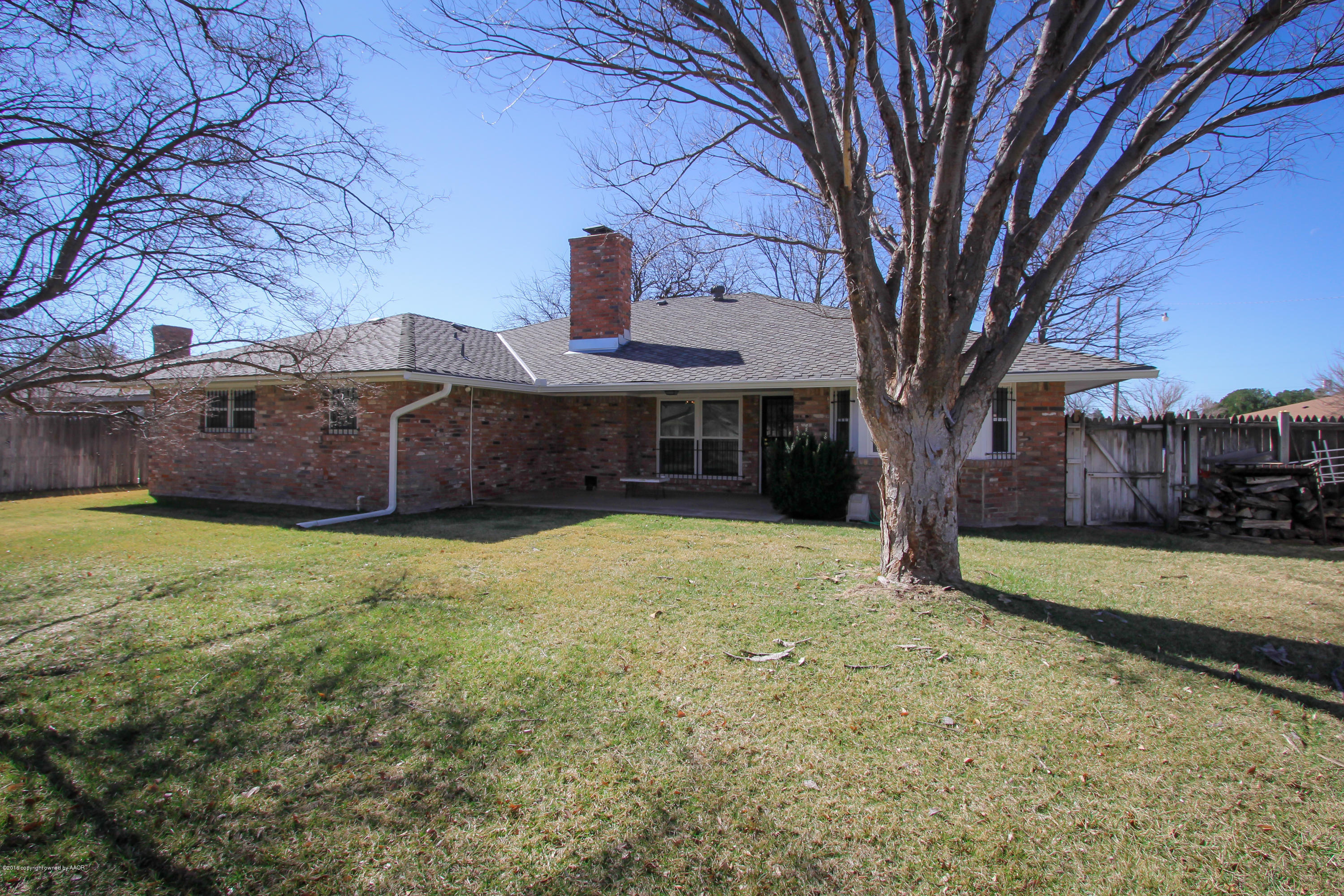 7012 Dreyfuss Road Amarillo, TX 79106 - Photo 24 of 39 a view of a house with a yard and tree