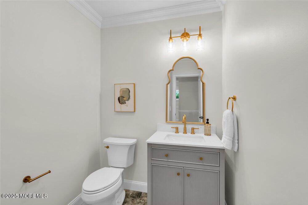 114 Harrison Avenue Red Bank, NJ 07701 - Photo 12 of 35 a bathroom with a toilet sink and mirror