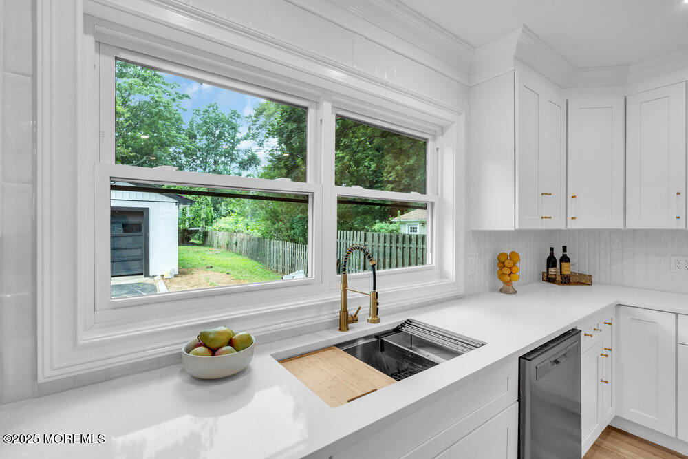 114 Harrison Avenue Red Bank, NJ 07701 - Photo 17 of 35 a kitchen with a window a sink and cabinets