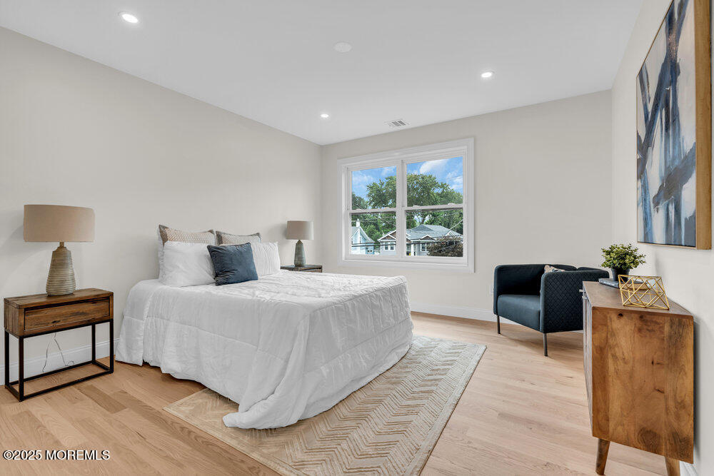 114 Harrison Avenue Red Bank, NJ 07701 - Photo 20 of 35 a bedroom with a large bed and a couch